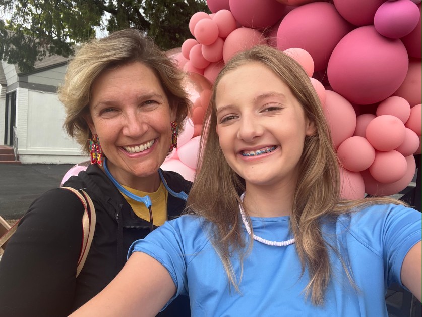 Mother and teen daughter smiling together