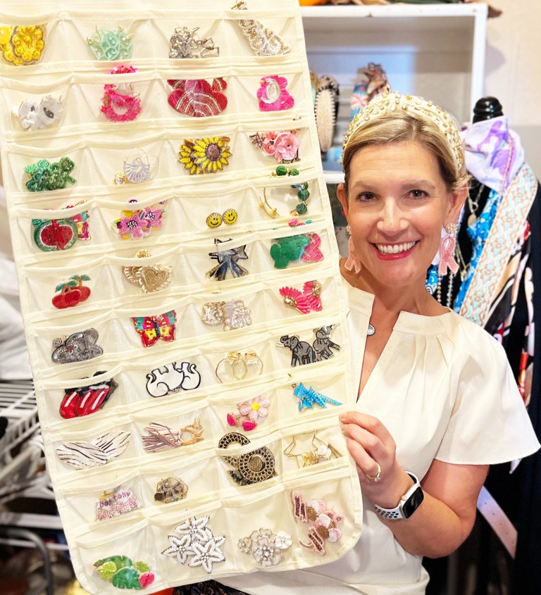 Breast cancer survivor with her beaded earring collection